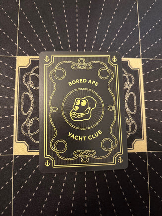 Mudwater #054 Never Alone actual card back, photographed October 24, 2026